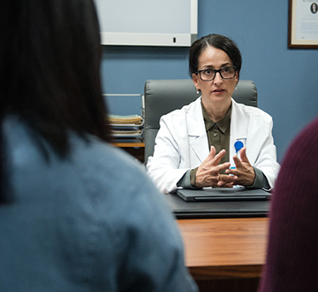 Man and woman meeting with a doctor; questions to ask your doctor