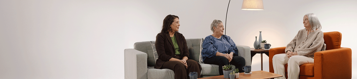 Three women sitting and having a conversation