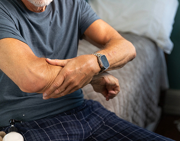Man rubbing his arm